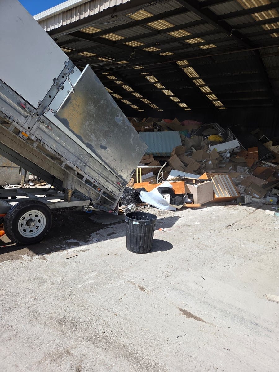 CleanUp Partners tip truck unloading demolished building materials, furniture and estate waste at a licensed Sydney transfer station